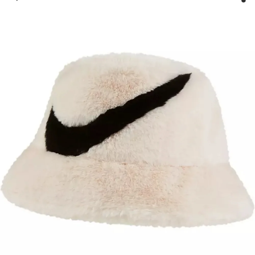 Nike Swoosh faux fur bucket hat in off white - Picture 1 of 4